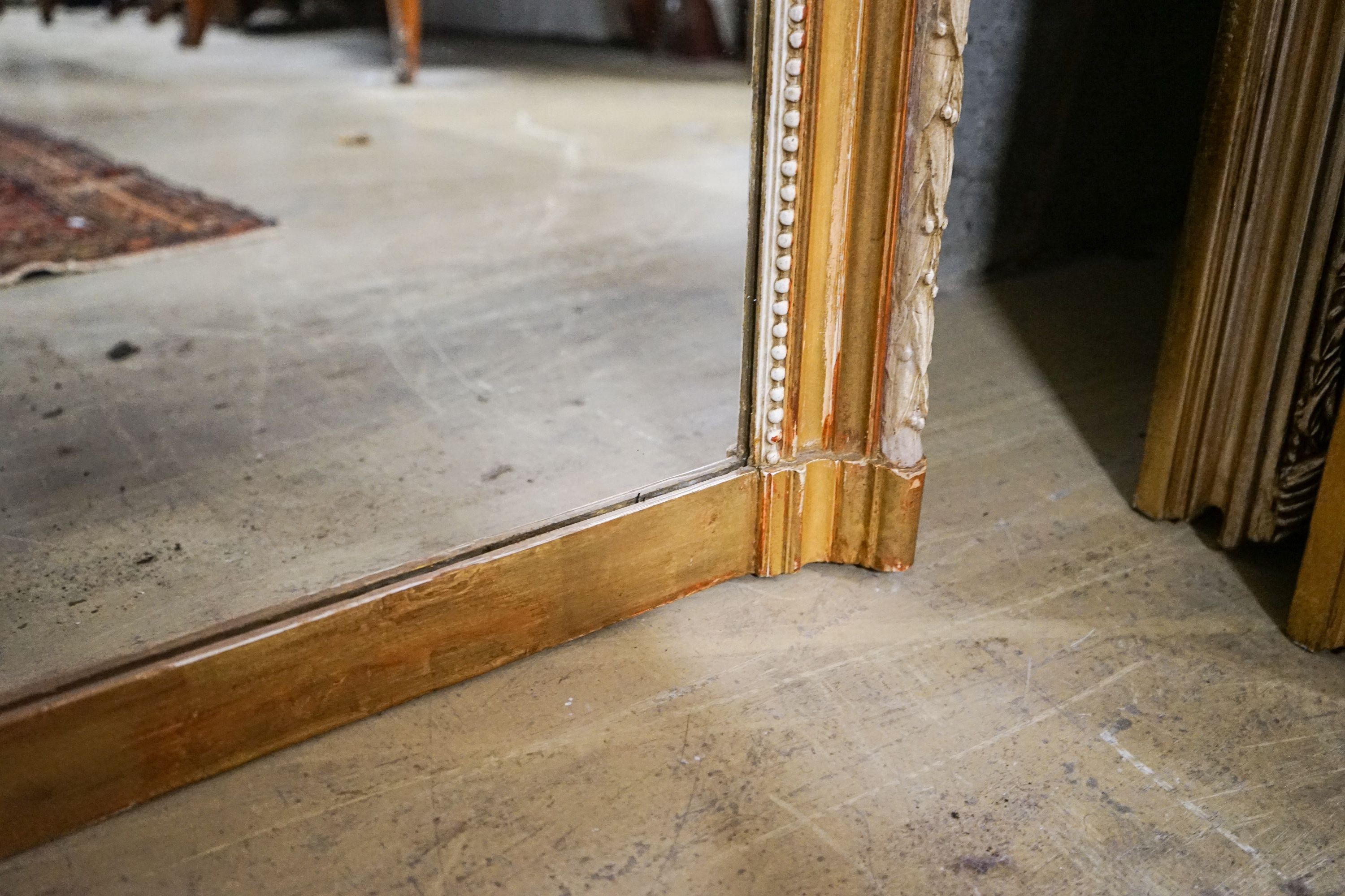 A large Victorian style rectangular carved giltwood overmantel mirror, width 109cm, height 156cm